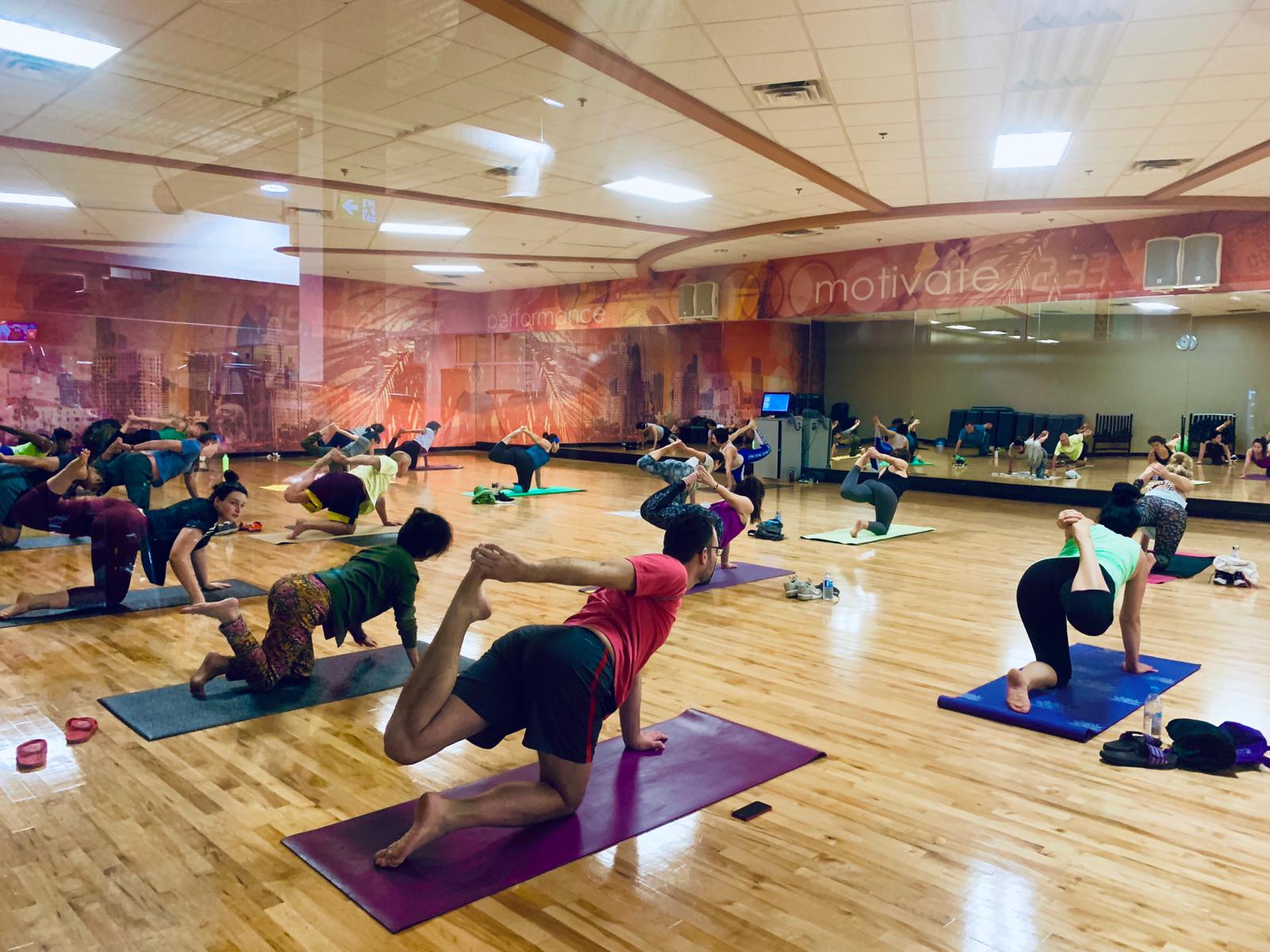 Ira teaching a full yoga class