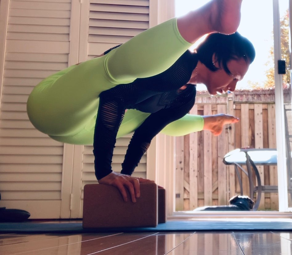 Ira in an arm balance on yoga blocks